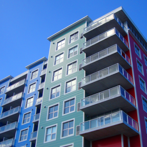 Picture of a multi-colored apartment building with at least 7 stories. Experiencing homelessness in Cincinnati?